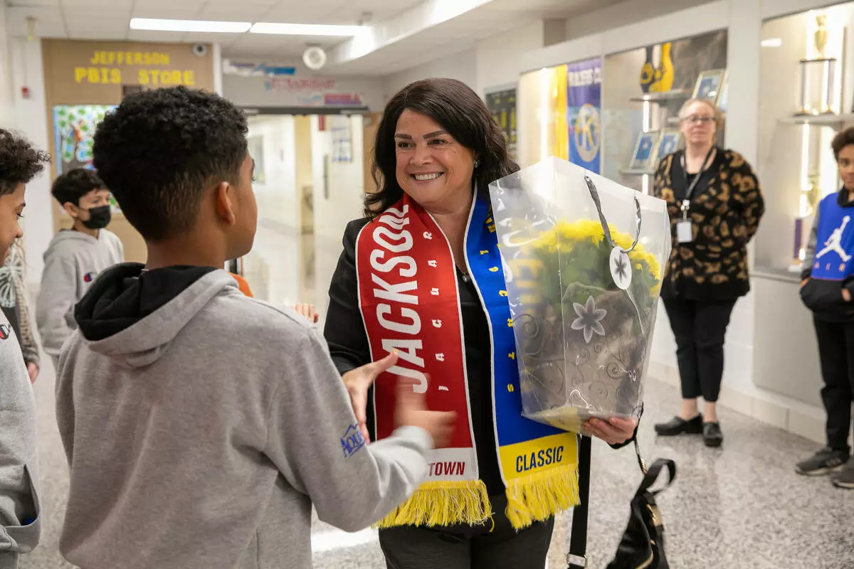 The students presented Dr. Ayala with a “Crosstown Classic” scarf featuring the names of all District 45 Schools.